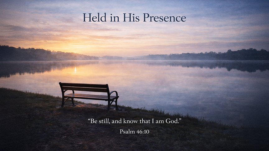 Held in His Presence — A wide 16:9 photo-realistic image of a quiet lakeside at early morning, smooth water reflecting soft light, with a single empty bench facing the horizon. The image includes the title Held in His Presence and the full scripture text of Psalm 46:10, symbolizing peace and stillness before God.